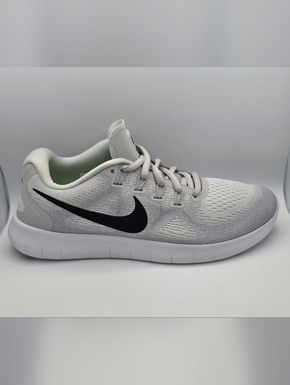 Nike Womens Free RN 2017 running shoes in a white and black colorway.